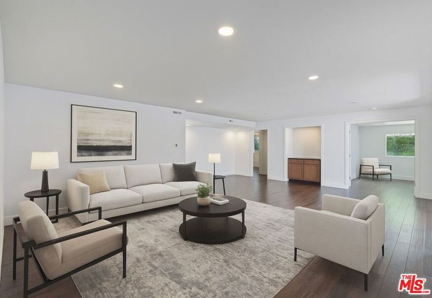 In the heart of Beverly Hills' world-famous 90210, this rare condominium offers the kind of space and privacy that's nearly impossible to find. With approximately 1,500 square feet, this two-bedroom, three-bath home lives large, providing generous rooms and an easy, open flow ideal for both daily living and entertaining. Set in an intimate building of just four residences, the property combines the quiet feel of a private retreat with the unbeatable convenience of a prime Beverly Hills address. Wood floors add warmth throughout, while the expansive kitchen complete with center island, abundant cabinetry, and space for casual dining anchors the home. Both bedrooms are ensuite, with a large primary suite. Enjoy the best of city living with acclaimed dining, luxury boutiques, and entertainment just blocks away. Additional perks include a stylish powder room, plentiful storage and two garage parking spaces. A rare blend of size, location, and exclusivity right in the center of it all.