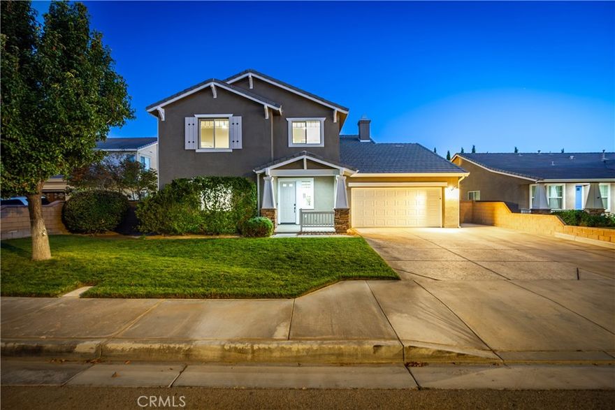 ***LIVE BEAUTIFULLY*** Welcome to this stunning five-bedroom, three-bath home nestled in the desirable West Lancaster community. No HOA & NO Mello-Roos! From the moment you arrive, you'll be captivated by its gorgeous curb appeal, featuring a beautifully landscaped front yard, a welcoming front porch, and an extended driveway that provides additional parking alongside a spacious three-car tandem garage. Inside, the home offers a perfect blend of elegance and comfort with a thoughtfully designed floor plan that includes a convenient downstairs bedroom and full bathroom, ideal for guests or multi-generational living. The formal dining room provides a wonderful space for gatherings, while the living area invites you to relax beside a gas fireplace enhanced with Rasmussen fire balls and an integrated television. The home is wired for sound in the fireplace room, dining room, and master bedroom, and even includes a 7.1 Onkyo speaker system in the dining area for an immersive audio experience. The massive kitchen is a chef's dream, boasting a 36-inch cooktop with a vent hood, double oven, quartz sink, under-cabinet lighting, plenty of cabinetry all around, and a reverse osmosis system for purified water at the sink. Throughout the home, thoughtful upgrades create a sense of modern comfort, including LED lighting in every room, new ceiling fans, and dimmer switches to set the perfect ambiance. Smart home features like Google Nest thermostats, a WiFi-capable Chamberlain garage door opener, and a Schlage keypad front door lock provide convenience and peace of mind. Upstairs, spacious bedrooms offer comfort and privacy, while the primary suite serves as a serene retreat, complete with sound wiring and stylish finishes. Step outside to a fully cemented backyard designed for low maintenance and outdoor entertaining. Additional enhancements include a whole-home water softener system (excluding exterior hoses), epoxy flooring in the garage, and exterior Ring cameras with motion detection for added security. A new water heater ensures efficiency, making this home as functional as it is beautiful. Every detail of this West Lancaster residence has been carefully considered to provide comfort, style, and sophistication. Move-in ready and meticulously maintained, this home perfectly balances modern upgrades with timeless appeal.