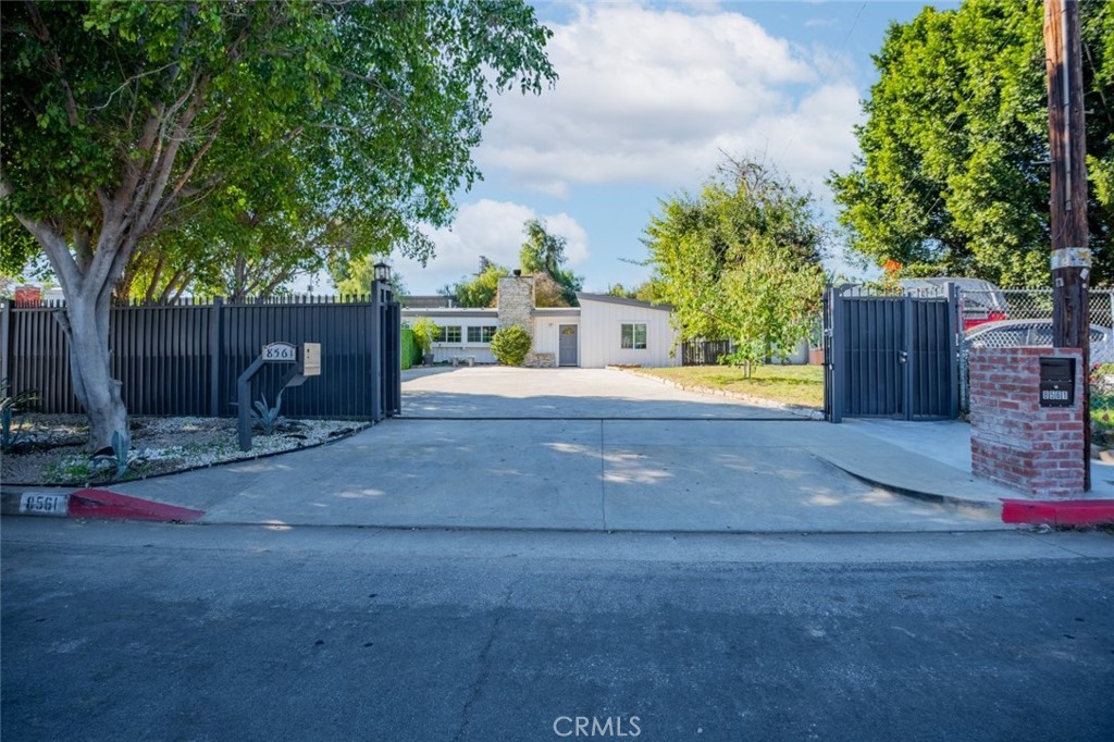 Recently remodeled home with onsite laundry hook ups and convenient driveway parking fit for 3 cars right in the heart of desirable North Hills! Total privacy! This fully gated property has a privacy fence surrounding the perimeter of this perfectly landscaped 1,250-sqft home. Upon entry, be dazzled by the wonderfully open and vibrant layout detailed with recessed lighting, HVAC, sleek wood and tile floors throughout, excellent window coverage, and high slopped ceilings to further accentuate the airy feel. The easygoing living room is made comfortable cozy by a raised hearth fireplace encased in rustic stonework. Glossy granite countertops adorn the neat shaker cabinets of this user-friendly kitchen equipped with built-in appliances and a large breakfast bar. Both bedrooms include built-in closets fitted with mirrored doors and there are two fully remodeled bathrooms. Accessible from a set of French doors, venture out the cover back patio and out to the restorative sunshine for the perfect amount of entertaining space. Just off the 405 freeway and down the street Panorama Mall, Vons, Target, Ralphs, Van Nuys Airport, local restaurants, shops, parks, and so much more!