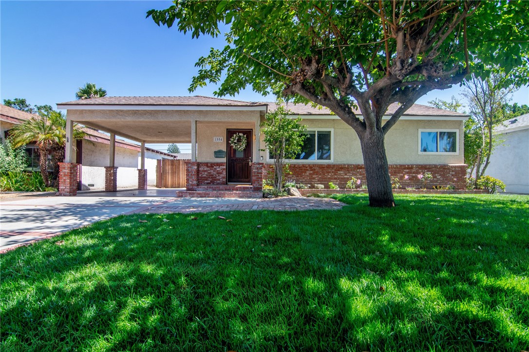 On the market for the first time in decades! This spacious 3-bedroom, 2-bathroom Burbank home is filled with charm and potential. Inside, you’ll find an inviting open-concept floor plan with the kitchen at the heart of the home, which is perfect for entertaining, hosting family gatherings, or casual everyday living. A step-down living room offers a cozy yet open feel, with an additional bonus room just off the living area; ideal as a home office, kids’ playroom, an extra bedroom, or creative studio.
The two secondary bedrooms are bright and generously sized, while the primary suite is a true retreat, featuring abundant natural light, a ceiling fan, plenty of closet space, and a conveniently accessible bathroom. Outside, enjoy a covered patio perfect for outdoor dining and relaxation. A long driveway with a carport leads to a 2-car detached garage, offering ample parking and storage.
Located in a highly desirable Burbank neighborhood, this home sits near top-rated schools, parks, and beloved local shops and restaurants. Best of all, it’s conveniently located close to Bret Harte Elementary School and the neighborhood favorite Coral Café, making it the perfect blend of convenience and community.