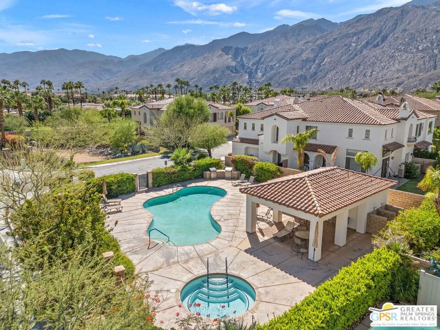 Fabulous Palm Springs pied--terre! In a prime midtown location behind the gates at Terra Vita, this home puts you just moments from downtown while offering a relaxing community setting. The living area is anchored by a stacked stone fireplace and enhanced by modern recessed lighting, while the open-concept kitchen features Caesarstone countertops, counter seating, custom tile flooring, and a spacious pantry. Light and bright throughout, the home includes baths with walk-in showers, and the ensuite primary retreat offers dual vanities and a beautifully tiled shower. Step out to your private balcony, accessible from both the dining area and the primary bedroom, to take in those iconic south-facing mountain views. Additional highlights include generous closet space, a separate laundry room with built-ins, and a direct access two car. Terra Vita is an intimate 42 home community with a resort style pool, spa, and poolside cabana with barbecues, and HOA fees are refreshingly reasonable compared to many others. Stylish, low maintenance, and close to it all, this home is perfect for seasonal use or full time living and welcomes you to your Palm Springs escape.