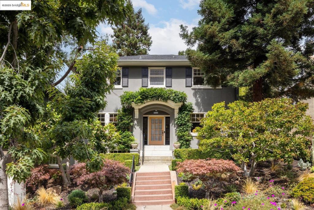 Discover this exceptional Four-Square gem in Crocker Highlands. Meticulously maintained and thoughtfully updated, gracefully blending classic character with modern luxury. The main level unfolds in a seamless flow, where a sun-drenched living room with a romantic fireplace and a generous formal dining room with built-in cabinetry and leaded glass windows connect effortlessly. The kitchen has been thoughtfully updated to honor its original charm while incorporating premium features like dual sinks, custom stainless steel counters, and high-end appliances, all complemented by a charming breakfast nook. French doors invite you out to the enchanting rear gardens.The three-tiered backyard is a true oasis. It provides a perfect setting for al fresco dining, relaxation in the hot tub, or peaceful moments among lush, mature plantings and Koi Pond. Tucked away in this garden paradise is a 120 sq ft studio with a lofted nook, for a home office or creative space. Upstairs, the home offers three bedrooms and two full baths. The elegant primary suite is a sanctuary of warmth and design, featuring an updated bathroom with custom lighting and a luxurious soaking tub. Two spacious bedrooms share a beautifully appointed bathroom. Just a few short blocks to Lakeshore shops and Crocker Elementary.