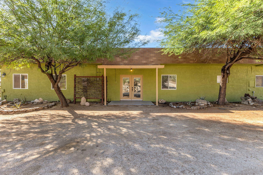 Discover the perfect blend of privacy, space, and desert beauty in this 5-bedroom, 2-bath ranch-style home, set on 2.5 acres of stunning land. Every room opens to the outdoors, creating seamless indoor-outdoor living and capturing the breathtaking panoramic views that surround the property.The single-story home features a spacious layout with a large kitchen at its heart, flowing into the open living and dining area. A charming fireplace stands front and center, adding warmth and character while expansive windows frame the incredible desert and mountain vistas.The master suite is a true retreat, complete with a cedar-lined closet and a luxurious clawfoot tub perfectly positioned to take in the sweeping views.A private well ensures self-sufficiency, while the long roundabout driveway provides both convenience and a grand arrival experience. Mature desert landscaping surrounds the home, offering natural beauty and peace.Whether you dream of a family ranch, a serene getaway, or a place to entertain under wide-open skies, this property delivers privacy, charm, and endless views. The property is reflected on title as a 1 bedroom, 1 bathroom residence. Additions and modifications appear to have been made by a previous owner. The Seller makes no representation or warranty as to the permits, approvals, or filings related to such additions or improvements. Permits and compliance status are unknown to the Seller