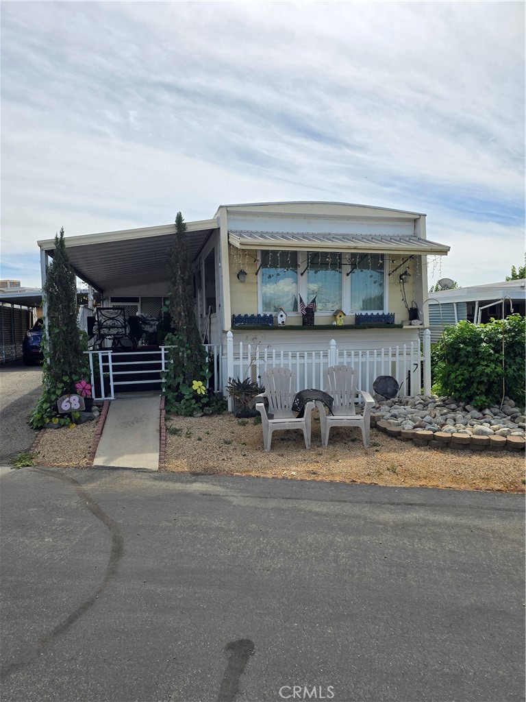 A must see to believe. A beautiful well maintained single wide mobile home located in a senior park in Yucaipa. This park is under rent control with a monthly bill of around $500.00. This includes space rent and some utilities. Nice spacious living room. Cozy kitchen with a double oven for baking. Spacious bathroom with all the amenities. Nice double closet in the bedroom. Side porch for washing machine and dryer. This coach comes completely furnish. All appliances are included. Only personal belongings will be taken. Plenty of storage area. Covered carport for your car.