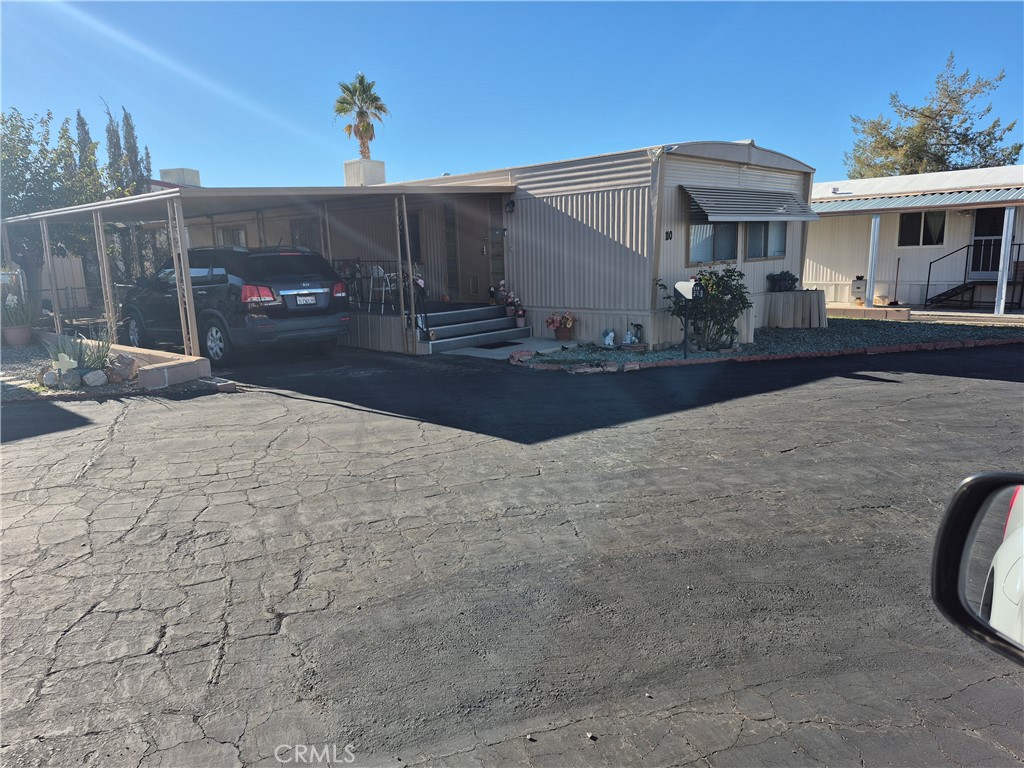 Double wide mobile home in a 55 plus senior park. Home features two bedrooms two baths with ample kitchen and lot of cabinets., All appliances are included excepted washer and dryer. Come to see this well keep home with  pride ownership. Laminated floors all throughout the house . Close to shops, bus station, hospital and all that you need in your daily basics.