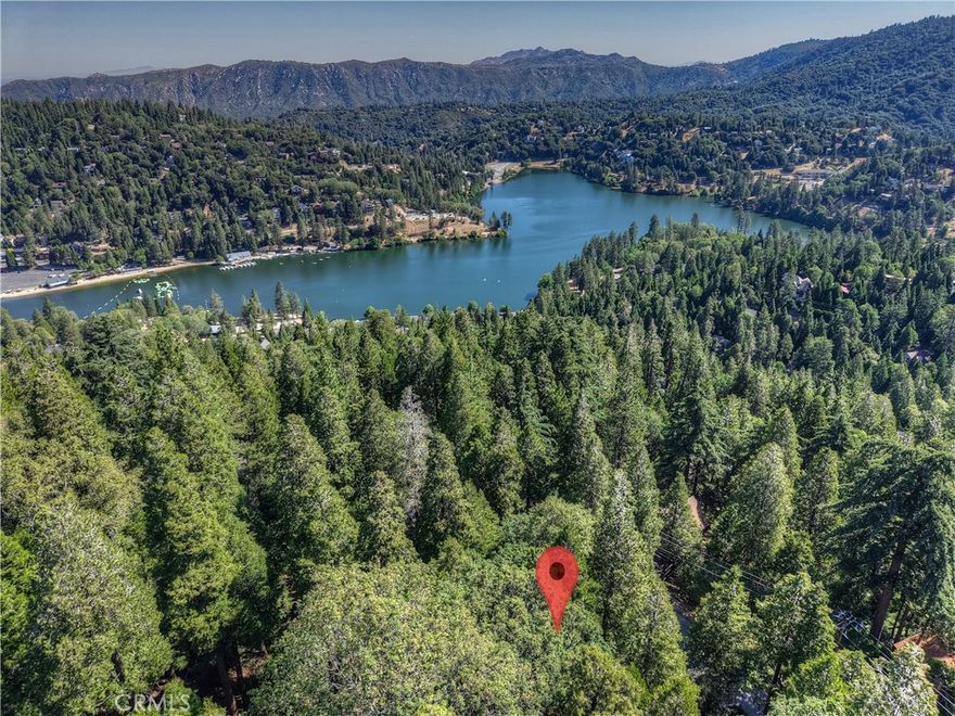 Seller financing may be available with agreeable terms ~ Build your mountain getaway in Crestline, California ~ This is a 7,170 square foot triangluar lot ~ Located just minutes from Lake Gregory, hiking trails, and loads of outdoor recreation ~ Buildable area is toward the center of the lot ~ Take in the fresh mountain air, year-round beauty, and experience a true sense of retreat ~ Bring your vision to life - your canvas in this San Bernardino mountain community awaits! No address has been assigned to this property.