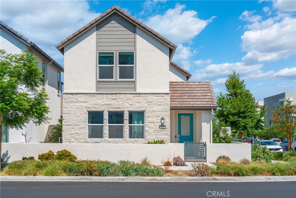 This 2022-built 4-bedroom, 3-bathroom home offers 2,656 sqft of upgraded living space on a rare three-side open corner lot in Solis Park, Great Park. The first floor features a full guest suite, while upstairs boasts a bright loft, a luxurious primary suite and two additional bedrooms. Thoughtfully upgraded with whole-house water softening and purification, smart kitchen appliances, enhanced flooring, solar panels, and a Tesla charging station. Just a 5-minute walk to award-winning Portola High and Solis Park School. Community amenities include parks, pools, trails, sports fields, and more.
