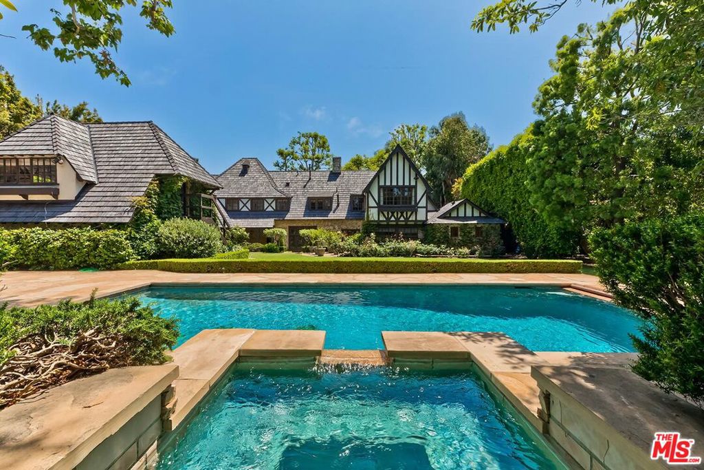 Spectacular estate located in prime Pacific Palisades on one of the most romantic streets in the Riviera. Designed by renowned architect Gerard Colcord in 1929. Published and featured in Architectural Digest in 1931. This home's sophisticated design invokes a rural farm lifestyle and is structured around a central courtyard with large grassy lawn, pool and spa. Stunning beamed living room with Colcord's signature dramatic oversized fireplace. Den or office with stained leaded glass windows. The home has been extensively remodeled, perfectly blending the original old-world charm with modern amenities. The history and prominence is apparent in every detail like the reliefs in the walls & the gothic-arched doors. A rare opportunity to live beautifully in the heart of the Westside of Los Angeles.