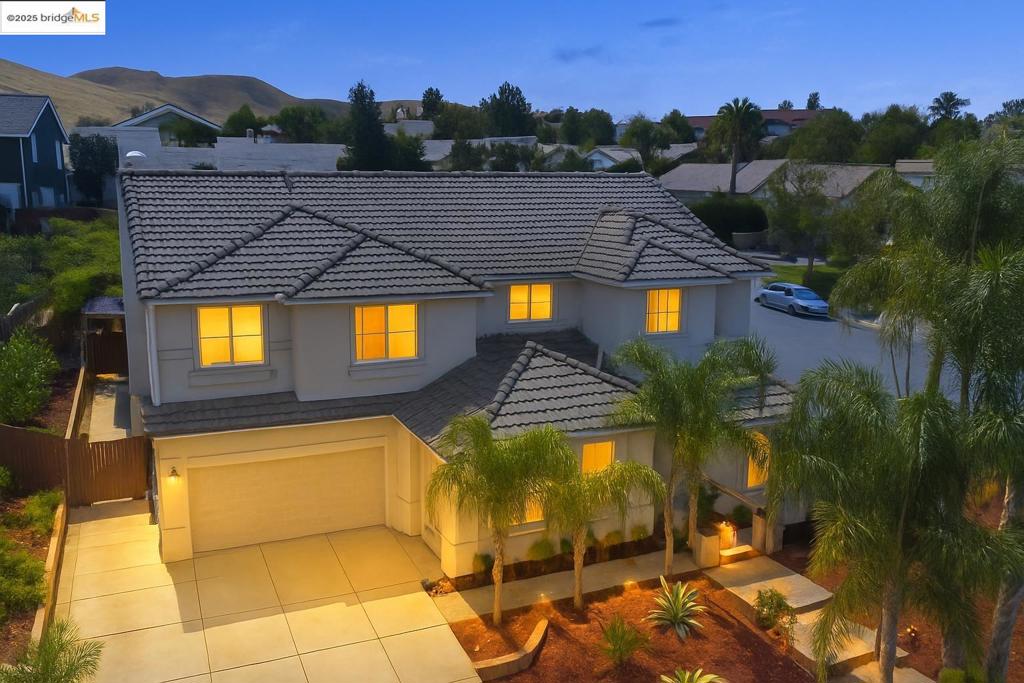 This STUNNING Meritage home is located in prestigious Black Diamond Estates in the hills above Lone Tree Golf Course. Tastefully updated this home offers 6 Beds, 3 Baths, nearly 3,800 sq ft on a 13,000+ sq ft corner lot. Grand Entry with vaulted ceilings and an abundance of light. 24” tiles in the Living Room, Formal Dining Room and Kitchen. Updated Gourmet Kitchen featuring granite counters, newer stainless-steel appliances, and walk-in pantry. Downstairs possible Primary (6th Bed) has a Fireplace. The city approved permit and plans for a new attached bath are ready for your completion! Additional Bed and Bath Downstairs. Exquisite Brazilian Hardwood flooring on the stairs, Loft, hallway and Upstairs Primary. The Upstairs Primary Bath is updated with gorgeous custom Tiles on the walls and floor, an updated shower, and 2 walk-in closets. The Hall Bath has been updated w/ custom tile, and shower. Newer HVAC and Water Filtration system. Easy to maintain yard, with unique custom hardscaping & landscaping. Relax in the Pagoda covered Hot Tub, elevated seating area or under the covered Patio w/ ceiling fans. Large side yard. Great location, close to schools, public transportation and EBart.