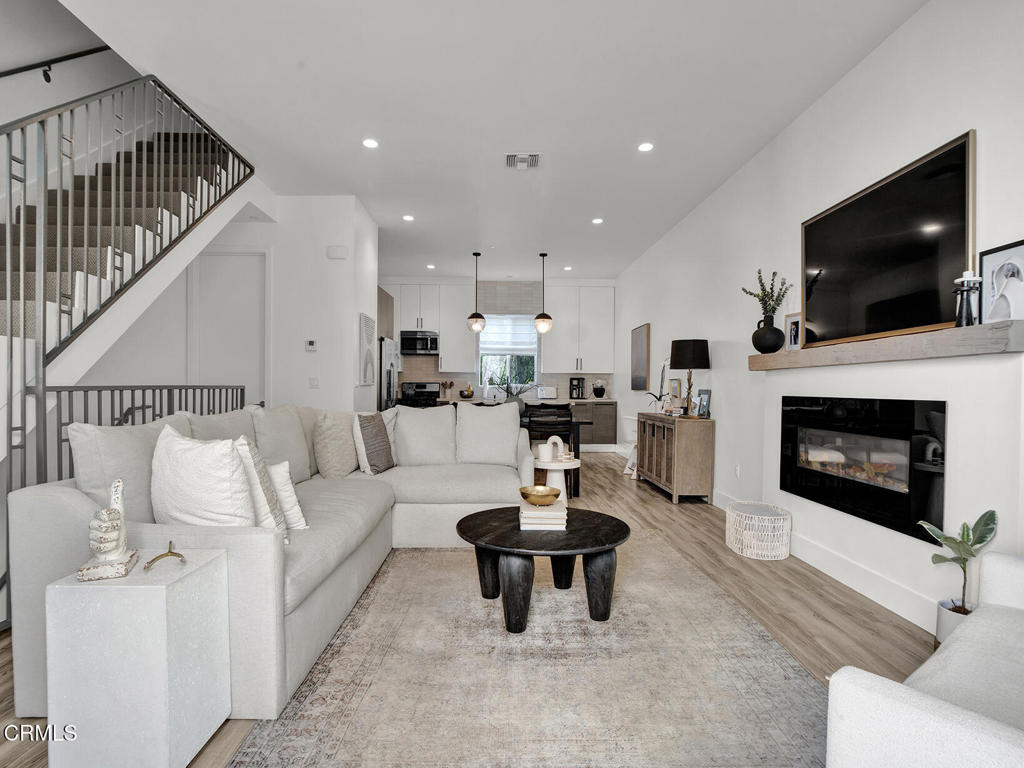 Step into this beautifully updated home, built in 2015 and thoughtfully designed with modern comforts and amenities throughout. Ideally located in a premier neighborhood with easy freeway access, top-rated Chandler Elementary, and all local conveniences, the home provides both comfort and lifestyle. Inside, you'll find bright, tall ceilings and open living spaces--perfect for everyday living and entertaining. With fresh interior paint, dual-pane windows, custom Roman shades, an upgraded staircase, and tasteful finishes, the home exudes quality and care.The remodeled kitchen is a true highlight, featuring updated cabinetry that extends to the ceiling, new countertops, and a designer tile backsplash. The main-level bathroom has also been stylishly upgraded with handmade Zia tile--bringing a touch of luxury and craftsmanship to everyday function.The open-concept layout seamlessly connects the spacious living room, kitchen, and dining area. Unlike any other unit in the development, the fourth bedroom is a true bedroom--offering rare flexibility, added versatility, and long-term value. Meticulous attention to detail is evident throughout and immediately noticeable upon touring.Tucked within a private and quiet community, the home also features an upstairs deck--ideal for enjoying your morning coffee or relaxing in the evening. With close proximity to shopping, dining, and neighborhood amenities, this is an exceptional lifestyle opportunity. Don't miss your chance to make it yours!