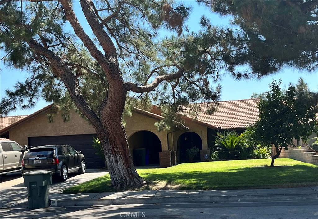 ***Spacious and Inviting Home with Pool & Spa!***
This beautifully designed home features a welcoming double-door entry leading into a spacious floor plan. Step down into the cozy family room with a fireplace, seamlessly connected to the open kitchen and dining/formal living area—perfect for entertaining or relaxing. A wide hallway leads to four generously sized bedrooms. Step outside to enjoy the in-ground pool and spa, huge, covered patio, and a large cement deck area ideal for gatherings or private retreats. The private backyard is enclosed by a block wall for added privacy. Additional highlights include a tile roof and excellent indoor-outdoor flow. Located in well-established neighborhood a plus!!