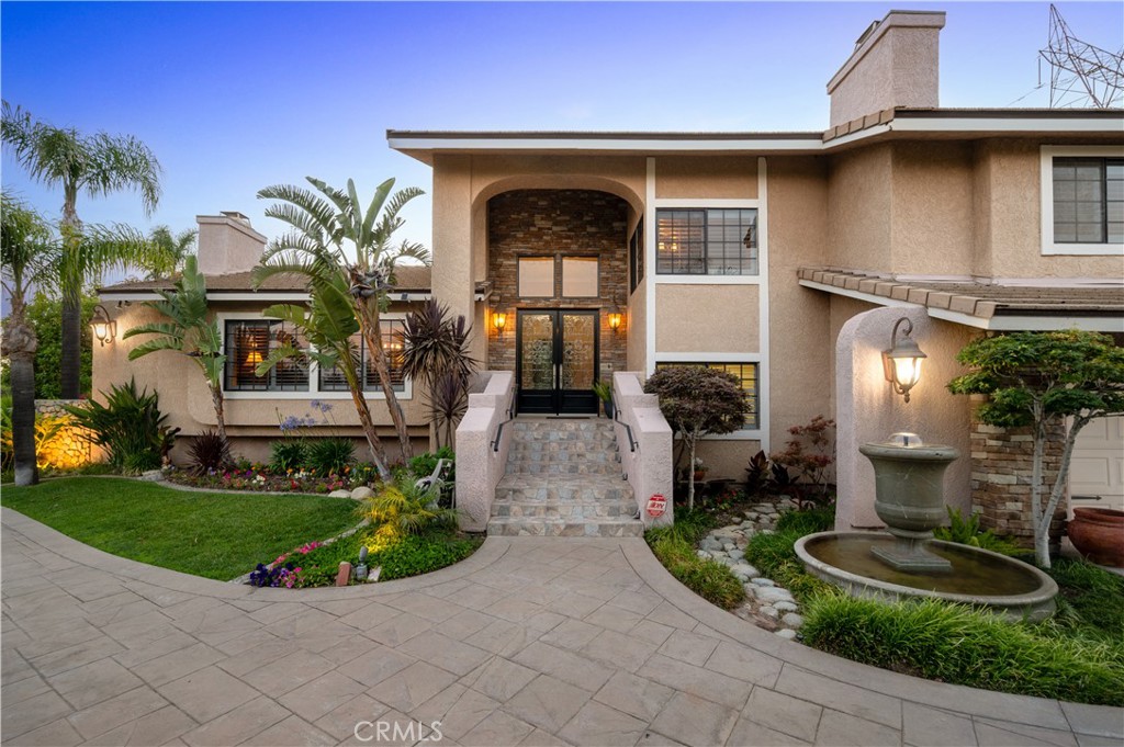 SAN ANTONIO HEIGHTS:
*. ELEGANT CUSTOM ESTATE: Secluded on Nearly an Acre - PLUS a Bonus Lot,
* MAIN RESIDENCE: 3,797 sq ft of luxurious, well-designed living space
* LOT SIZE: .97 acre plus adjoining 10,500 sq ft lot with separate APN (#1003-121-24-0000)
* BEDROOMS/BATHROOMS: 4 spacious bedrooms & 3 beautifully updated bathrooms
*. BONUS ROOMS:
* Dedicated library, home office, expansive laundry room & wine cellar
*. GOURMET KITCHEN: Remodeled with quartz countertops, high-end appliances, custom cabinetry – opens to the Great Room
* ENTERTAINER'S DREAM:
*. Formal living & dining with dramatic vaulted ceilings & floor-to-ceiling fireplace
* Casual dining & open-concept family space
*. Elegant Finishes: Rich wood floors, 4 fireplaces, vaulted ceilings, and designer touches throughout
*. BAR: Offers plenty of open entertainment space in the greatroom
* STUNNING OUTDOOR OASIS:
*. Resort-style pool with waterfall
*. Built-in outdoor kitchen & gazebo
*. Expansive stone patio with lush landscaping & sweeping views that enhance the indoors
*. Library Retreat: Built-in wood bookshelves, cozy fireplace & vintage tin ceiling – a showstopper
*. VERSATILE ACERAGE:
*. Gated access to rear grounds – perfect for RV garage, horse corrals, or potential ADU
* Currently offers RV parking with RV hookups
*. Additional lot currently features an avocado orchard – endless possibilities!
*. PRIME LOCATION: Tucked away in the serene foothills of San Antonio Heights, yet minutes to Upland amenities
* A rare opportunity to own a secluded, custom-built estate with room to grow, entertain, and enjoy Southern California living at its best!