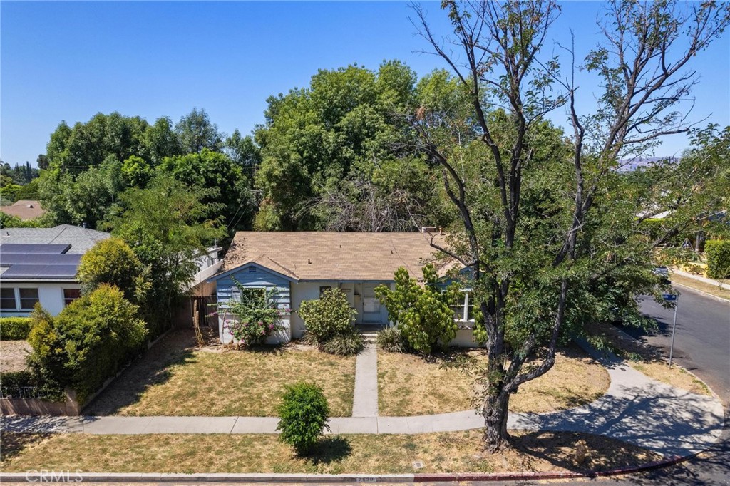 Prime Winnetka Fixer! Set on a spacious 7,360 SQFT corner lot in one of Winnetka’s most sought after neighborhoods, this 3 bedroom, 2 bathroom residence presents an incredible opportunity with endless upside, appealing to both owner-users and investors alike. Offering 1,251 SQFT of living space, the home features a great layout with hardwood flooring, smooth ceilings, dual pane windows, indoor laundry, and galley styled kitchen with a quaint breakfast area. Bedrooms are all ample sized and have good closet space. Detached 2-car garage could serve as an ideal space for potential ADU. The expansive lot provides ample room to reimagine both the home and grounds, whether creating your dream retreat or unlocking additional income possibilities. Conveniently located near Pierce College, The Village at Topanga, Westfield Topanga Mall, Warner Center’s shopping, dining, and entertainment, and the Orange Metro Line for easy commuting - plus great freeway access! A wonderful chance to bring your vision to life in a prime Winnetka location.