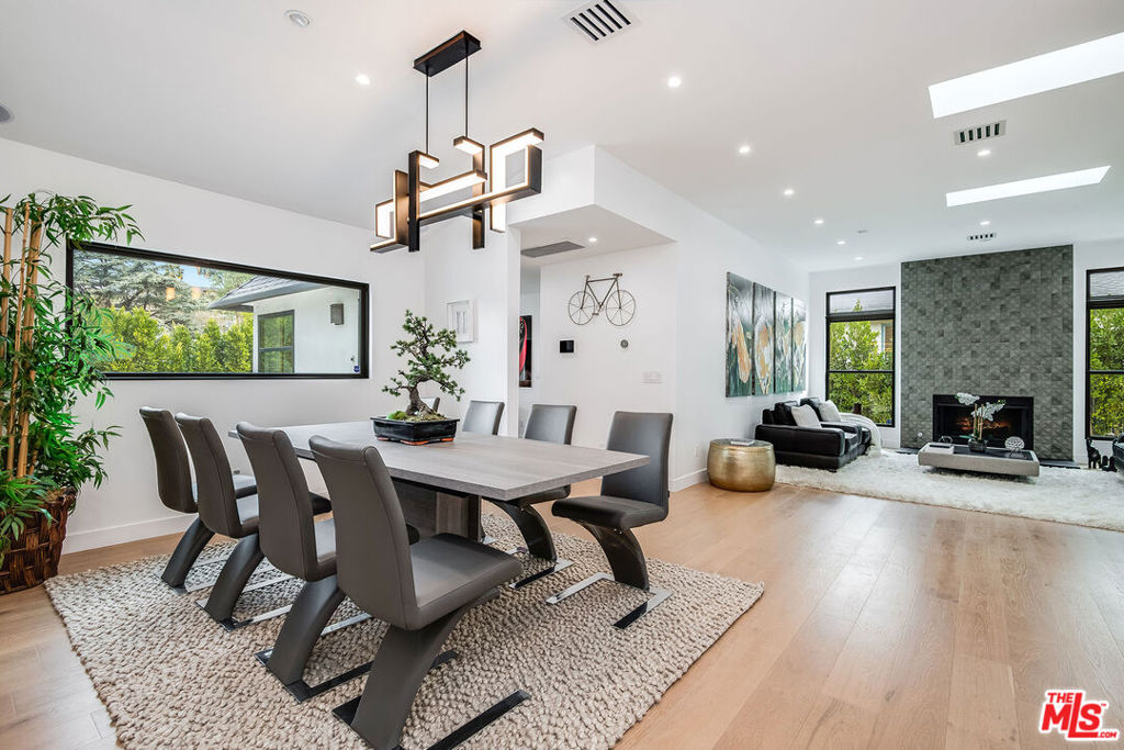 ***Available Furnished or Unfurnished!!*** Gorgeous modern design on a gated lot south of Ventura Blvd. in the heart of Sherman Oaks. This recently undated home features 4 bedrooms each with ensuite bath, plus movie room (or 5th bedroom also with own bath). Light & airy open concept living space with hardwood floors and high ceilings, pool, spa and a secluded tiered yard to relax and entertain. Amazing center island with ample seating in the custom kitchen opens to the family room with panoramic glass doors opening to the patio. Formal dining and living room have soaring ceilings and separate space. All bedrooms include private en suite bathrooms plus 1/2 bath for guests. Great multileveled primary suite with sitting area and giant walk in closet! The luxurious bathroom includes a soak room with large tub and shower in one, plus double sinked vanity. High end features throughout with custom furnishings, built-in sound and solar panels (not activated yet but will be). Outdoor kitchen with BBQ, lounging areas, grass behind custom pool and spa, fire-pit, and outdoor shower. Great schools as well as close proximity to Ventura Blvd shops and eateries. Ready to make this your new home! Short term or long term leases available!