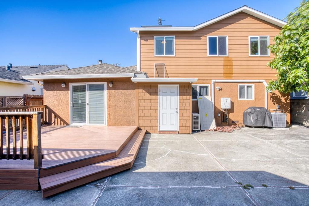Welcome to this stunning Northeast-facing single-family home, perfect for a large family or an excellent investment opportunity! This property features two separate living units; the ADU has its own private entrance. It also includes two 400-amp service panels and four car charging outlets, catering to the needs of modern households. Newer interior/exterior paint, copper plumbing, and sewer lateral in 2023. Upon entering the main unit, you're greeted by a spacious foyer that opens into a bright, light-filled living room with large windows. The adjoining dining area flows into a gourmet kitchen, boasting granite countertops, stainless steel appliances, and ample cabinet space. The main level offers one bedroom and a full bathroom, ideal for guests or multigenerational living. Upstairs, you'll find two spacious suites with a private sitting area and a convenient half bathroom. The converted garage features two additional bedrooms and a full bathroom, offering incredible flexibility for extended family or rental income. Located near schools, parks, shopping centers, hospitals, and dining, and with easy access to Highways 880 and 580, this home combines comfort, convenience, and investment potential. Don't miss the opportunity to make this exceptional home yours today!