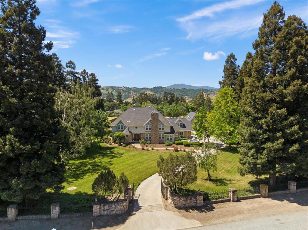 Spacious Estate with Huge Potential in Coyote Valley. Welcome to 9885 Lantz Drive, an exceptional 2.37-acre property in Morgan Hills desirable Coyote Valley. This 5-bedroom, 4-bath urban ranch-style home offers 4,401 sq ft of living space, an updated kitchen and upstairs bathroom, and a spacious primary suite with soaking tub and walk-in closet. Highlights include an attached two-car garage with loft, plus a permitted 1,500 sq ft bonus garage/workshop. The expansive lot offers endless potential to add a pool, sport court, ADU, or more. Located in a gated neighborhood with Private Water Association and easy access to Hwy 101, 85, and Silicon Valley. Enjoy privacy, space, and convenience in one of South Bays most scenic settings.