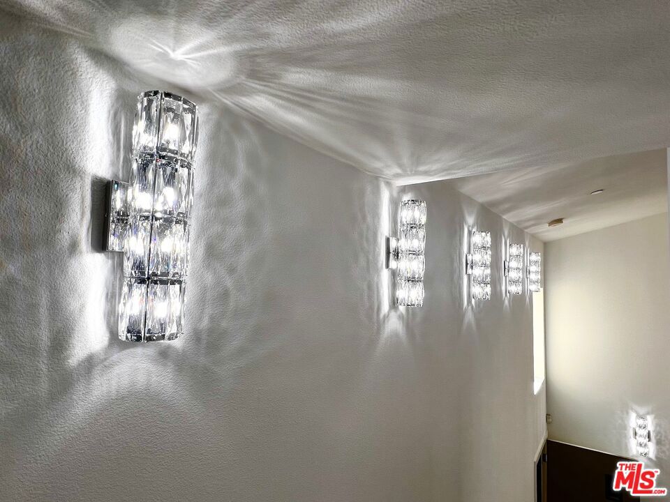 AMAZINGLY CURATED INTERIOR DESIGNED WITH MODERN LIGHT FIXTURES FOR THE NEXT PROUD PENTHOUSE OWNER. THIS ONE IS FOR YOU!! ONE OF A KIND UNIT, NOTHING LIKE THIS IN THIS BUILDING, UNIQUE AS YOU ARE. COME AND SEE FOR YOURSELF. NEW AUTOMATIC WINDOW BLINDS. NEW MODERN GOLD CHANDELIER, NEW 12 & 16 LIGHTS Modern Crystal & Chrome Dandelion Chandeliers hanging Light Fixtures on the KITCHEN CEILING, NEW BATHROOM VANITY LIGHTS, 13 NEW Crystal Modern Wall Sconce vanity light fixtures throughout the entire home. Wall paneling on Living-room TV wall & Primary Bedroom wall downstairs. Entrance wall papers with inviting flowers. Also, RARE IN THIS LOCATION- Brand NEWLY BUILT IN 2009. 2 BEDROOM 2 1/2 BATHROOMS, LAUNDRY IN THE UNIT. EV CHARGER INSTALLED FOR THE NEXT Home OWNER. MINUTES FROM THE FAMOUS FARMERS MARKET, THE GROVE, THIS IS THE "IT" PLACE. MUSEO, truly the heart of LA. Enjoy the convenience of sites and stores within walking distance. This condominium has a sleek and modern design and features many amenities. Lounge with your coffee or a cocktail on your private balcony as you enjoy your Best city view. Bask in natural light and the openness your cathedral ceilings provide. Add a spacious living area to complement the ambiance. Your luxury penthouse comes with secured underground parking for up to 2 cars and a gym with both machines and weights. Don't let this opportunity pass you by to enjoy city living in elegance, style & convenience. Don't miss it!! More photos & Video to come.