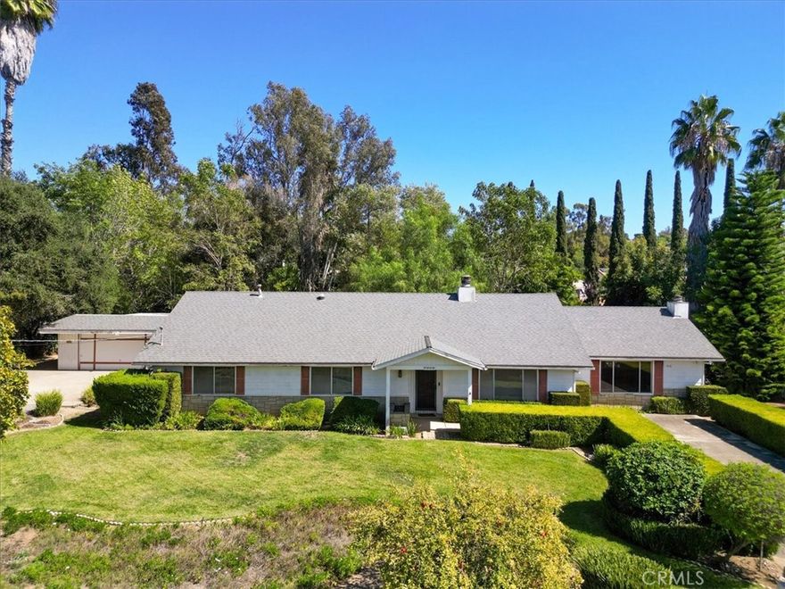 Discover the possibilities in this spacious single-level home, offering 3 bedrooms and 2 baths across 2376 square feet on a generous .50 acre lot.  Bring your hammer and paintbrush, as this property requires some TLC; however, with your vision and effort, it has the potential to shine once again.  Enjoy the private backyard setting with mature trees and lush landscape nestled next to a seasonal creek that runs adjacent to the property.  The detached two-car garage is a bonus, featuring a laundry room and workshop, perfect for hobbies or extra storage. Nicely upgraded kitchen with granite counters, newer cabinets and appliance.   Located just minutes from downtown and walking distance to Village View County Park, this home offers a prime location in the heart of Fallbrook.  Don't miss out on the chance t make this your dream home!