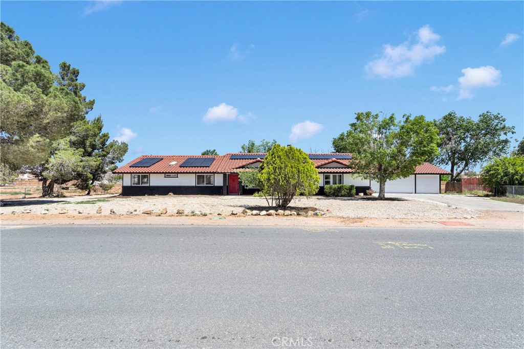 Welcome to this beautifully remodeled 4-bedroom, 3-bathroom home with an attached 1-bedroom, 1-bathroom guest suite featuring a full kitchen, ideal for guests or rental income. Situated on over an acre of land, this property offers ample space for RV parking, toys, a pool, or pets. The home shines with modern upgrades, including new windows, cabinets, flooring, bathrooms, fresh paint, and more. Energy efficiency is boosted by two sets of solar panels. The spacious 3-car garage includes attached storage, easily convertible to a 6-car garage or additional storage. Centrally located near freeways, shops, schools, parks, and upcoming establishments, this home combines luxury, versatility, and prime location!