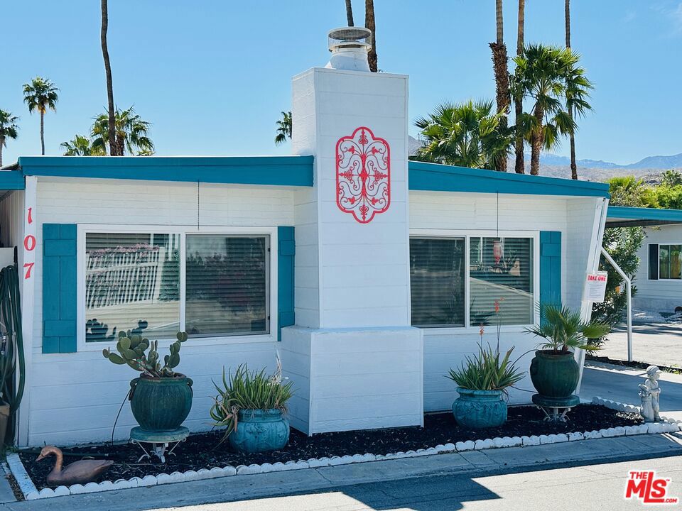 A rare find in coveted Palm Springs View Estates - THE premier rent controlled park in Palm Springs. This charming 2 bedroom, 2 bath home sits on a quiet, corner lot on a dead-end street. Featuring 1,000 square feet of living space which includes an over-sized great room w/ a natural gas fireplace, a formal dining room w/ built-ins, a partially renovated kitchen and an indoor laundry room. While updated where it counts, the home cleverly retains vintage charm - from original kitchen appliances to the bedroom built-ins. Complete with newer, high-end laminate flooring throughout, newer Jeld Wen windows, an in-window evaporative cooler, brand new Central HVAC, two year old Mitsubishi mini-split, and a washer & dryer - this one has it all. Save money on electricity with the updated cook top, furnace, water heater and dryer which - all run on natural gas. A fenced, dog friendly yard and enclosed patio round out this amazing property. This quiet community features three pools with hot tubs, a clubhouse, shuffleboard courts, green space, and access to the new biking trail. It's pet friendly and close to shopping; Trader Joe's, Target, Walmart, Lowe's, etc., as well as golf, restaurants, and more! Activities abound. The HOinc (HOA) is largely a social group for entertainment, with multiple events monthly. Membership is voluntary and only $30 per year. AND... as if it couldn't get any better, the lot rent is under rent control! Just $574.63 per month includes water, sewer and trash! Palm Springs View Estates is a 55+ community. Schedule your tour today!