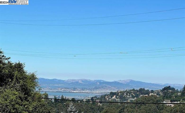 GENERALLY LEVEL BUILDING PAD FROM VILLANOVA LANE and a flat corner lot located in a quiet neighborhood above Skyline Drive in the Montclair District of the Oakland Hills. The property is situated at the corner of Villanova Drive and Villanova Lane, to the left of the house at 10 Villanova Lane. THE MAJORITY OF THE LOT IS GENERALLY LEVEL AND CAN BE ACCESSED FROM VILLANOVA LANE. PLEASE NOTE THAT WHEN VIEWING THE LOT FROM VILLANOVA DRIVE, APPEARANCES MAY BE MISLEADING; THE LEVEL PAD IS ACCESSIBLE VIA VILLANOVA LANE. The property offers views of the Bay to the West and Mount Diablo to the East. It is one of the few available vacant, generally flat, view corner lots in the Oakland Montclair Hills, where most lots are on steep terrains. This lot presents a unique opportunity for building a custom home or for professionals such as builders, architects, and general contractors to construct a custom-built spec home.