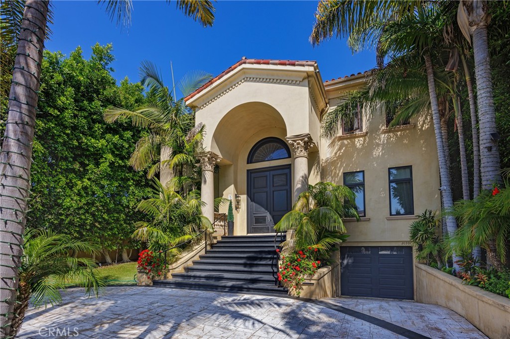 Grand Newport Beach Estate | over 7,000 Sq Ft | Private Tennis Court, Pool & Spa and 7-Car Garage. Commanding nearly half an acre in the coveted equestrian-zoned enclave of Newport Beach, this extraordinary 7,300+-square-foot custom estate captures the timeless elegance of a Mediterranean masterpiece with modern refinement.
A stately arrival unfolds through handcrafted double doors into a breathtaking foyer, crowned by dual spiral staircases — a stunning architectural centerpiece. The interiors blend formal sophistication with contemporary comfort, offering refined formal living and dining rooms, a voluminous family room anchored by a wet bar, rear-projection cinema screen, and Crestron home automation.
At the heart of the residence, the gourmet kitchen is an entertainer’s dream, appointed with granite countertops, custom cabinetry, a butler’s pantry, and integrated appliances, designed to flow seamlessly into the home’s gathering spaces.
The primary suite is a private sanctuary, warmed by a romantic fireplace and featuring a spa-caliber bath complete with steam shower, dry sauna, and custom walk-in wardrobe. Two additional upstairs en-suite bedrooms offer private retreats, while the main level also offers 2 separate guest suites.
Effortlessly serving all three levels, a private elevator descends to an expansive subterranean seven-car garage — a rare luxury in this prestigious location.
Outside, an entertainer’s paradise awaits: a shimmering resort-style pool and spa, a full-size illuminated tennis court, and verdant landscaped grounds provide both serenity and grandeur.
Steps from the Back Bay’s scenic trails and nature preserves, yet moments to world-class beaches, dining, and shopping, this is a rare offering — a lifestyle of unparalleled elegance and comfort. Also available for sale.