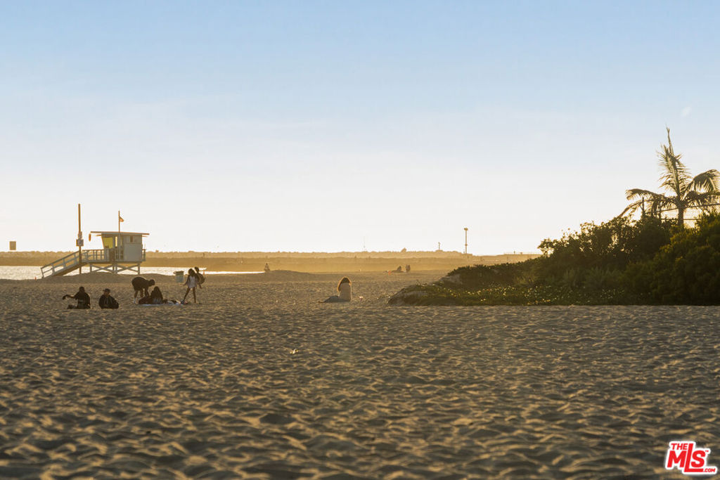 Don't miss this rare opportunity to live just steps from the sand! Enjoy stunning ocean, city, and lagoon views in this beautiful, spacious, and bright 3-bedroom, 3.5-bath penthouse with a townhome-style layout. The home features new beachy hardwood floors, soaring ceilings, and large windows that flood the space with natural light. Designer touches create a warm and inviting atmosphere. The primary bedroom boasts a balcony with a beach view, while the kitchen is equipped with high-end appliances and offers both style and functionality. The dining area is perfect for entertaining, and the unit includes a large washer/dryer, Wi-Fi, cable, and large flat-screen TVs. Furnishing is available as an option. Located just half a block from the beach and a short walk to town, restaurants, shops, and stores, this quiet and well-maintained building also provides two enclosed parking spaces and access to a shared bike room. Coastal living at its finest!
