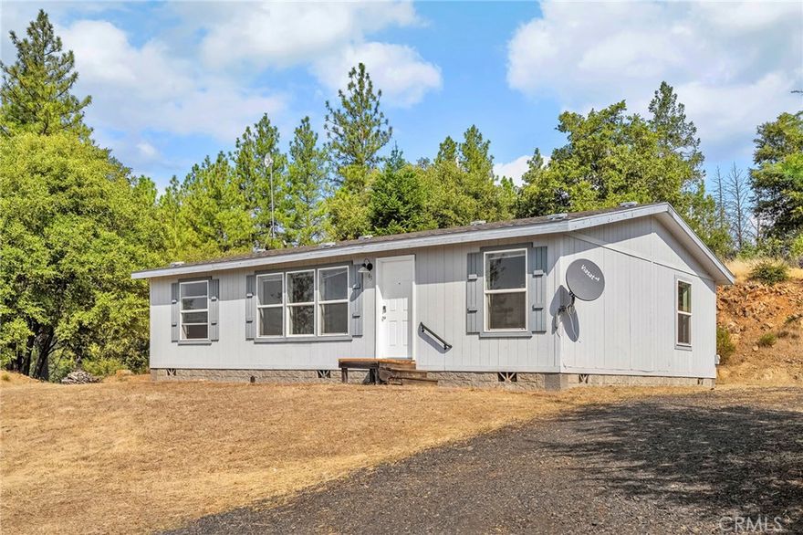 Enjoy peaceful mountain living on just under 6 acres, with wide-open views and room to grow. This well-kept 3 bed, 2 bath home offers privacy and functionality just minutes from Lake Oroville with a split floor plan. Features include a whole-house generator, RV parking with full hook-ups, and plenty of usable land—ready for a shop, garage, or garden. Tucked away at the end of a quiet road, this property blends seclusion with convenience, only 25 minutes to town. Outdoor recreation is right nearby, with Lake Oroville offering boating, fishing, hiking, and weekends on the water.