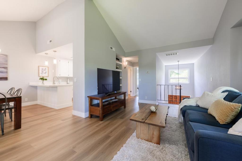 Beautifully updated end-unit townhome offers privacy, views, & peaceful setting w/ no rear neighbors, just open greenbelt & nature as your backdrop. Nestled in the highly sought-after Scottsborough neighborhood, this home feels like a tranquil treehouse retreat! Step inside to a spacious, light-filled living room w/ vaulted ceilings and oversized windows that flood the space w/ natural light & showcase scenic views. The stylish kitchen features quartz slab counters, crisp white cabinetry, newer SS appliances, premium water softener system, & pantry. Step out to the balcony deck to enjoy al fresco dining w/ nature all around. The primary suite is a private oasis w/ soaring ceilings, full en suite bath, and Elfa closet system. Two additional bedrooms offer flexibility, one features a Murphy bed & built-in desk, ideal for a home office/guest room, while the other opens to a private backyard deck. Additional highlights include: Attached garage with EV charger; Spacious attic for bonus storage; Newer Anlin double-pane windows; New LVP flooring and carpet. Enjoy resort-style living w/ maintained grounds, pool/spa, & prime location just a short walk to parks, dining, shopping, & top-rated Scotts Valley schools. Easy access to Hwy 17 puts the beach or Silicon Valley just minutes away!
