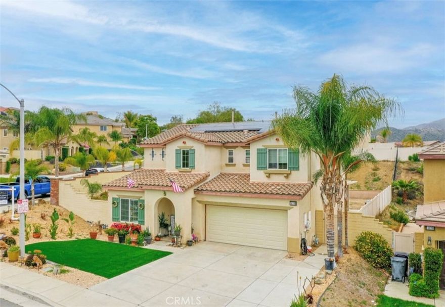 Welcome Alberhill Ranch! This spacious beautiful CORNOR LOT home sits highly elevated with views of the Hills and Community with one of the largest lots in the neighborhood. Home features 4 spacious bedrooms/2.5 Bathrooms, Loft with a Tech Space, Sitting room, Formal Living/ Dining Rooms, Family Room that opens to the Kitchen and finished 3 Car Garage with Epoxy Flooring. At the curb you will be pleased to notice the drought tolerant landscaping with Turf lawn and beautiful appeal. As you step into the home you will find a nice open floor plan. Formal Living and Dining areas sit side by side offering a great room for all your family gatherings. Large tiled floors lead you throughout the first floor. Kitchen features Granite Countertops, Stainless Steel appliances, Large center island with breakfast bar and Wall to wall cabinets for all your storage needs. The Master bedroom is a true retreat with a luxurious Master ensuite. Custom tiled walk in shower and soaking tub with a TV to relax is a dream come true. Private Balcony off the master will allow you to sit back and enjoy the views. The backyard can truly be your getaway. The expanded full length covered patio can provide shade and comfort to the home. A Built in BBQ will be amazing to entertain your guests. Currently a spa, water fountain and Gazebo are there to cool you down.  Solar panels provide enough electricity to run the house and for the owner to receive money back at the end of every year! Community Amenities include a pool and spa, splash pad, waiting pool, park, bbq,  picnic areas and is pet friendly. Great Location, Close to Shopping, restaurants and close access to freeway. Don't miss it!