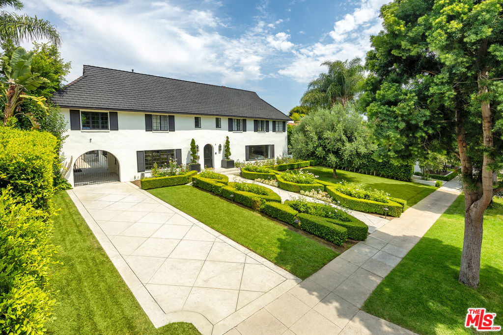 Prime 600 block Arden. One of the most beautiful blocks in the flats of Beverly Hills. Elegant and refined, this renovated gem features all the modern amenities. Center hall plan with 2-story foyer, formal living room with fireplace and large formal dining room. Indoor/Outdoor flow from gourmet kitchen and lounge. Massive outdoor living room, perfect for entertaining with full bar on par with finest hotels. Upstairs, 5 bedrooms including a spacious primary with large marble bath and walk-in closets. Additional features include: screening room, wine cellar, tv lounge, guest house, 2-car garage, private pool, and outdoor kitchen.