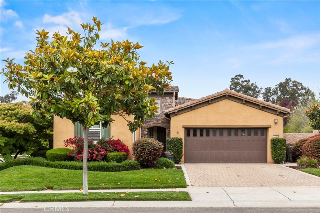 Resort living awaits at Trilogy Monarch Dunes! This former model Monterey plan sits on a desirable corner lot with a park-like backyard and abundant natural light. The 2-bedroom layout plus bonus room with French doors offers flexible space for an office or guest room. The open floor plan features a great room with fireplace, dining nook, and chef’s kitchen with granite counters, stone backsplash, and JennAir Euro-style appliances. Expansive windows in the living area, kitchen nook, and primary suite frame stunning backyard views. Added highlights include built-in garage cabinets, solar power, and thoughtful upgrades throughout. Trilogy Monarch Dunes is an all-ages community offering resort amenities: Monarch Club, Adelina’s Bistro, Sandalwood Spa, fitness center, pickleball, tennis, a championship golf course & more, including a Dignity Health center providing heath care just minutes from your doorstep. Move-in ready and beautifully maintained, this home and community capture the best of Central Coast living.