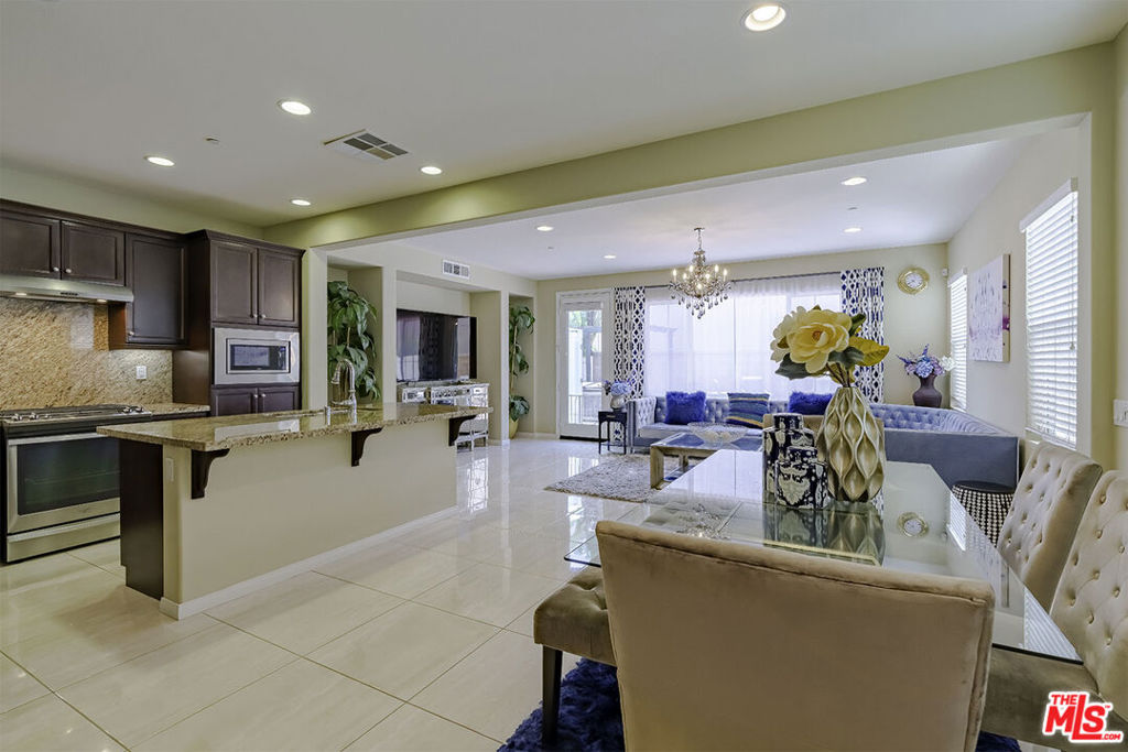 Welcome to this upgraded spacious free standing townhouse in the desirable gated community of Harbor Highlands. Upon entering, you are welcomed by high ceilings and lots of natural lights. This open floor plan boasts a large family room with a glass slider that leads out to a private patio. The kitchen has granite countertops, center island with breakfast bar, cabinets with pull out drawers, stainless steel appliances and ceramic tile flooring throughout. The main level also has an open dining area, powder room, and attached two car garage. Upstairs are four spacious bedrooms (one is being used as an office/retreat) and a laundry room with built-in cabinetry. The primary suite has a large walk-in closet, oval tub, separate shower, double vanity with granite counter top. Other features include upgraded flooring throughout, built-ins, double pane windows, tankless water heater, recessed lighting, central HVAC. The patio is very private no back-to-back neighbors, gazebo, spa, private outdoor shower and pet cleaning sink. Perfect to entertain friends and family for summer BBQ. Harbor Highlands Community features a community pool with grassy area and plenty of guest parking. Low HOA fees and is centralized to Target, restaurants, shops, schools, freeway 110 and is minutes from beaches, hiking trails, a new waterfront development community.