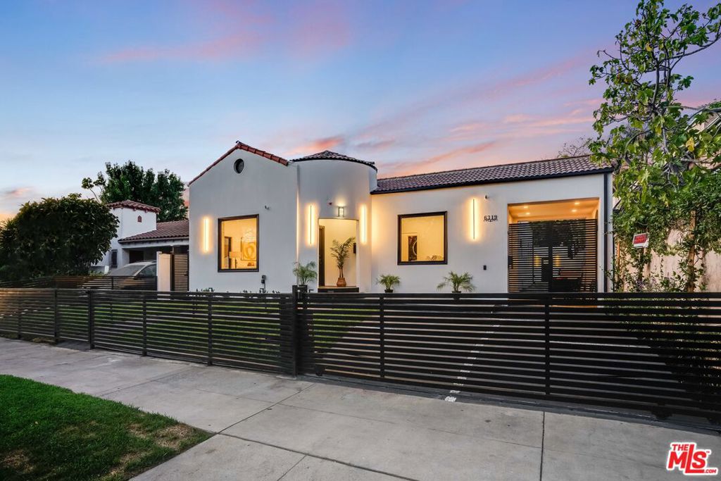 Welcome to 6319 Colgate Avenue, a fully remodeled designer home in the heart of Beverly Grove featuring approximately 2,461 sq ft in the main house plus a 1-bedroom, 1-bath ADU with its own private entrance and dedicated address, measuring approximately 522 sq ft. This 4-bedroom, 3.5-bathroom house including a stylish powder room showcases a modern chef's kitchen, two spacious living and family rooms, a formal dining area, recessed lighting, elegant modern chandeliers, sleek linear ceiling vents, and a luxurious primary suite with his and hers closets. The home is wired for security, includes a motorized front gate, and features built-in speaker and entertainment systems throughout. Every detail of the remodel was completed with approved plans and permits. The detached ADU offers ideal flexibility for guests, rental income, or a home office located just moments from premier shops, dining, and attractions in one of L.A.'s most desirable neighborhoods.