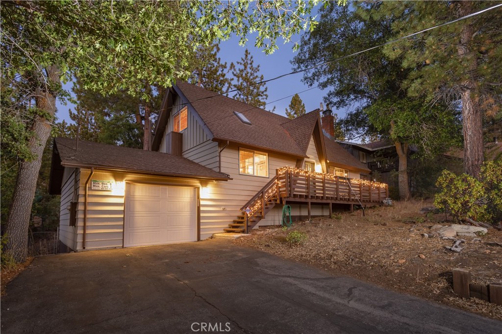 Walk to Snow Summit! This spotless mountain retreat features 3 bedrooms that comfortably sleeps a crowd. Enjoy stunning views from the front deck and large picture window in the living room. The home has been tastefully updated with dual-pane windows, granite countertops, updates thoughout, and Bathroom Remodels. Relax in the spa or let the kids and pups play in the fully fenced backyard. Gently sloped lot in a prime location—just minutes from the slopes, lake, and village. Whether you're looking for a turnkey vacation home or income-producing rental, this one's a gem. Don’t miss it!