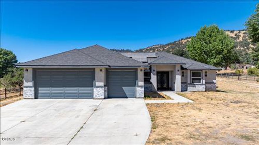 Country Living Redefined! Discover the perfect balance of modern comfort and rural charm in this stunning Bear Valley Springs horse property. Offering 4 BD/2BA and 2,348 sq. ft. of thoughtfully designed living space, this home welcomes you with soaring ceilings, bamboo flooring, and an open-concept layout that feels bright and inviting. The spacious living room features direct access to a serene back patio, creating an effortless indoor-outdoor lifestyle.The custom kitchen is a chef's dream, highlighted by double ovens, quartz countertops, a farmhouse sink, and a generous island with eat-at seating, perfect for everyday living or entertaining with ease. The split-wing design provides privacy, with a luxurious primary suite that boasts dual vanities, a walk-in closet, a tiled shower, and a freestanding soaking tub for ultimate relaxation.Designed for equestrian living, the property includes horse shelters, ample space for trailers and RVs, and plenty of room to enjoy the outdoors. Additional highlights include an oversized laundry room, a 3-car garage, owned solar, and elegant custom finishes throughout.Come experience why this isn't just a home, it's a lifestyle!