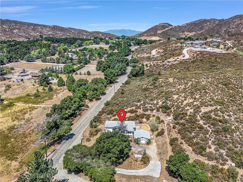 Nestled on over an acre of land adorable property locatedin the community of Twin Pines. This property is off the 10 frwy off 243 Hwy. You can be in down town palm springs or Idyllwild in less then 30 minutes. The home has been updated and has plenty of light with a great floor plan and lots space. The kitchen has brand new modern slow close cabinetry and drawers with pleanty of work area also nice size island. Great property for a little farm with lots of room for chickens and vegetable garden. Next to large 2 car garage there is a perfect spot for your RV! Come get out of the heat and enjoy the beautiful views and clean air!