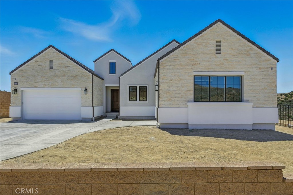 Ridge at Bella Vista by Toll Brothers offers sixty-five unique expansive equestrian homesites in a secluded rustic enclave. This homesite provides a long and private driveway that can entertain multiple cars for your family gatherings. This Silverado floor plan is tucked away at the western side of the Ridge community, offering canyon vistas with breathtaking sunsets from every room. The Silverado floorplan’s inviting covered entry and welcoming foyer flows past the flex office space with 12 x 8 glass stacking doors into the expensive great room, 90 Degree Multi-Slide door opens to the desirable covered luxury outdoor living. Additional features include 12 x 8 glass multi stacked doors at the casual dining area with coffered ceilings in great room. The well-equipped gourmet kitchen is highlighted by a large center island perfect for entertainment and family gatherings. Upgraded flat panel high reflective white cabinets, fresh furniture package offers cabinets to the top of our 10-foot-high ceilings. Waterfall quartz kitchen island, upgraded hardware, stainless steel state of the art Wolf appliances and Subzero Refrigerator. The private primary bedroom off the kitchen offers 11 ' coffered ceilings, 12 x 8 glass stacking doors that takes you into the peaceful and oasis backyard where you are surrounded by the sounds of singing birds and magical canyon vistas. The Primary bathroom offers a dual-sink vanity, spa like large soaking tub, luxe glass shower includes a ceiling mounted shower head and private water closet. With a dream walk in closet offering much space to showcase your collections. Large multipurpose flex space that can be used for game room, playroom, theatre room and so much more, spacious secondary en-suite bedrooms offer canyon vistas facing west.