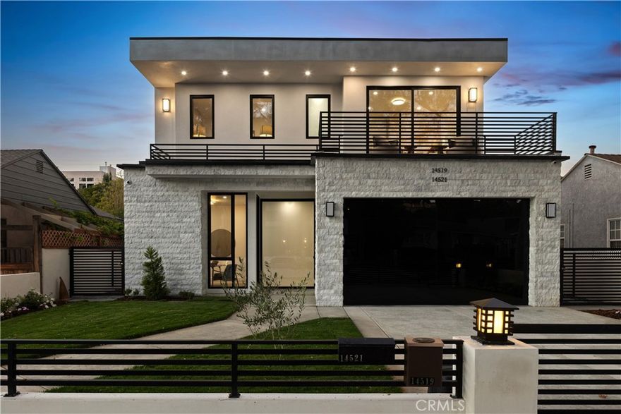 Situated South of the Boulevard on one of the most desirable streets in Sherman Oaks, this newly constructed gated estate offers a 5-bed, 6-bath main house and 1-bed, 1-bath ADU. Designed for modern living, the bright and airy open-concept floor plan is highlighted by lofty ceilings and walls of glass that flood the space with warm natural light. A culinary enthusiast's dream, the gourmet kitchen comes equipped with top-of-the-line Monogram appliances, quartz countertops and a large island with bar seating. The spacious family room features a sleek fireplace and floor-to-ceiling sliding glass door that spans into the kitchen, seamlessly extending your living space outside for true indoor-outdoor living. Head outside to your serene backyard retreat, where you can take a refreshing dip in the sparkling pool/spa, entertain guests in style or relax in total tranquility. Rounding out the main level is a formal living/dining room with a built-in wine cabinet and additional oversized sliding glass door that opens to a side courtyard, along with an ensuite bedroom and powder bathroom. Ascend the floating staircase to find four generously sized ensuite bedrooms and a dedicated laundry room. Unparalleled luxury awaits you in the expansive primary suite, which boasts a private patio, custom walk-in closet and lavish ensuite bathroom, complete with a soaking tub, oversized rainfall shower, smart toilet and double vanity. At the rear of the property, a versatile 1-bed, 1-bath ADU with a living room and full kitchen provides the perfect space for extended family, guests, an office or home gym – the possibilities are endless. Additional highlights include solid hardwood floors, a security system, central vacuum, high end Fleetwood pivoting front door, two-car garage with a frameless glass door and a gated driveway. Perfectly positioned in the heart of Sherman Oaks, this property is only moments away from trendy restaurants and boutique shops found along Ventura Boulevard, and offers easy access to the Valley, Westside, 101/405 freeway and so much more.