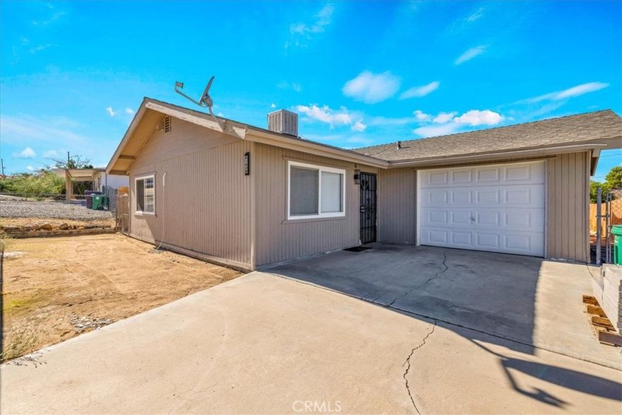 Welcome to 61830 Grand View Circle — where modern comfort meets desert magic in the heart of Joshua Tree Village.

This beautifully updated 2-bedroom, 1-bath home is more than a place to live — it’s a lifestyle. Step inside to find new energy-efficient mini-split heating & cooling, fresh paint, newer flooring, and an updated bathroom, paired with both a central wall furnace and evaporative cooler so you can choose between economy and comfort. The attached garage is no ordinary garage — it’s a flex space with its own cooler and wall furnace, perfect for parking, a creative studio, or an entertainment lounge. Slide open the back doors and you’ll step onto an elevated deck with a shade sail, the ideal perch for sunrises, stargazing, and unforgettable desert evenings. Out back, a fully powered and plumbed shed retreat takes this property to the next level. The left side offers a bonus full bathroom, while the right side opens into a finished mini-room with custom tongue-and-groove woodwork — perfect as an outdoor bar, art studio, or extra storage. Outside, you’ll love the 15' x 15' paver patio for gatherings and a private outdoor shower for a refreshing cool-down under the Joshua Tree sky. With thoughtful upgrades, versatile spaces, and one-of-a-kind desert charm, this property isn’t just a home — it’s your desert sanctuary. Don’t miss your chance to experience 61830 Grand View Circle today!