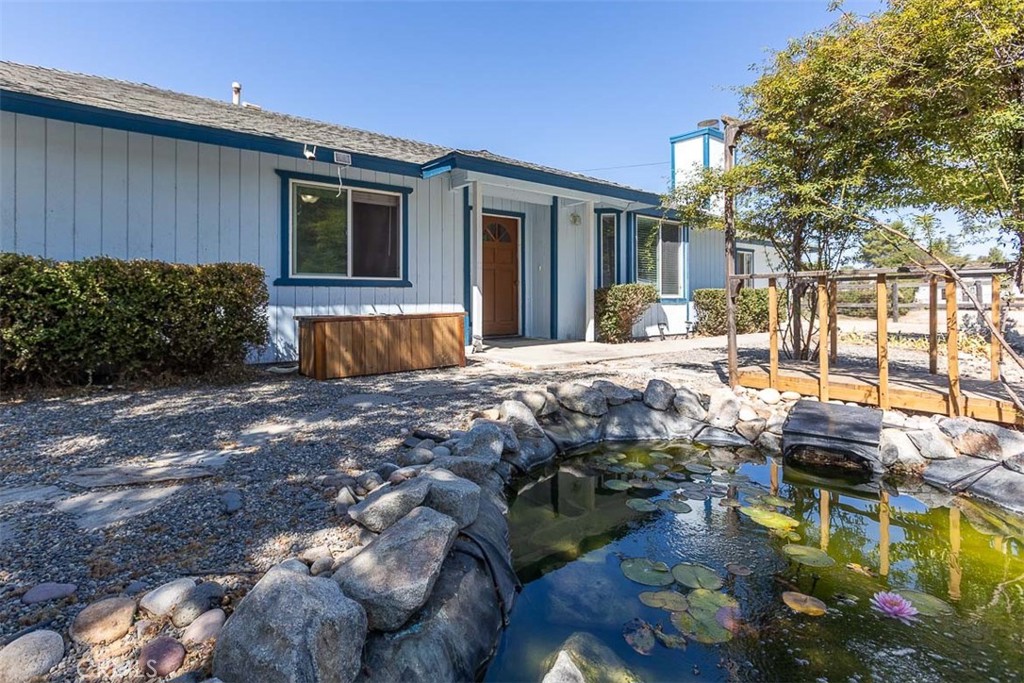 Embrace county living in the heart of Paso Robles wine country.  This single-level 4-bedroom, 3-bathroom home is situated on a usable acre lot with a huge detached shop.  This home features nearly 2,700 square feet of comfortable living space,  offering 2 primary suites with attached bathrooms, a bonus room, and a tastefully updated kitchen with solid surface countertops.  Outside, you will find a massive 1,200 square foot shop with two roll-up garage doors, perfect for hobbies, extra storage, or workspaces.  There is also a separate chicken coop, greenhouse, and storage shed.  Other amenities added to the property are owned solar and an 800+/- foot well.  With plenty of room for animals or personal projects, this property offers the perfect country lifestyle with the convenience of being just minutes from town, award-winning wineries, and local amenities.