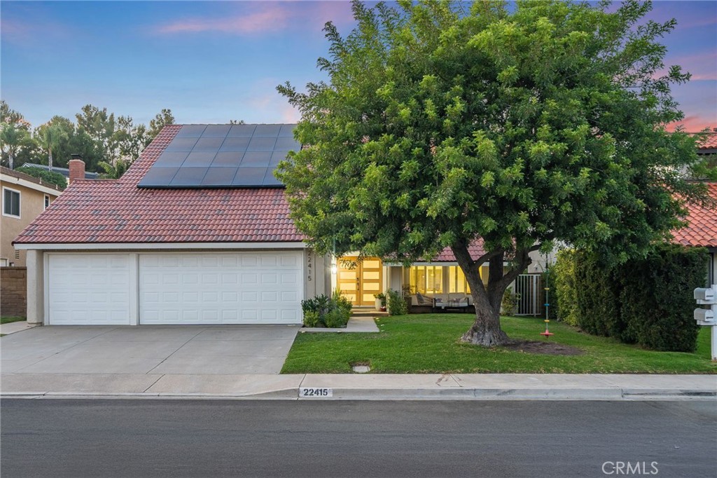 Nestled in Mission Viejo’s sought-after Madrid Del Lago at 22415 Salmeron, this impeccably renovated 5-bedroom, 3-bathroom home spans 3,081 square feet, blending elegance and modern comfort. Ideally situated on a cul-de-sac, it’s a short stroll from Lake Mission Viejo, Irvine Spectrum, shopping, parks, and trails, offering a serene retreat for families.
Elegant double wood front doors open to a grand foyer with a custom sweeping staircase and exquisite light fixture. The formal living room exudes contemporary charm with LED recessed lighting, herringbone luxury vinyl flooring, and a walnut acoustic slat wood panel for warmth. The adjacent dining room flows into a fully remodeled kitchen, featuring soft-closing custom cabinets, a large island, Quartz countertops, a 5-burner gas cooktop, stainless steel appliances, and under-counter lighting. The open floor plan connects to a family room with a cozy electric fireplace, wet bar, and abundant windows, opening to the backyard for seamless indoor-outdoor entertaining.
The main level includes a bedroom, remodeled bathroom, and laundry room with garage access. Upstairs, the primary suite offers a sitting area, white shutters, and a luxurious ensuite with a soaking tub, walk-in shower, dual vanities with LED mirrors, and custom closets. Three spacious bedrooms with ceiling fans and a third full bathroom complete the upper level.
The expansive backyard, with glazed porcelain patio floors, grass, and mature orange and lemon trees, is ideal for barbecues or quiet evenings. Residents enjoy Lake Mission Viejo amenities, enhancing the lifestyle. The home features energy-efficient upgrades, including a whole-house re-pipe, 20 paid-off solar panels, an EV charging outlet, efficient HVAC, double-pane windows, and central air, all with low HOA fees and no Mello Roos.
Don’t miss this exquisite home combining timeless elegance with modern functionality. Contact us to schedule a viewing!