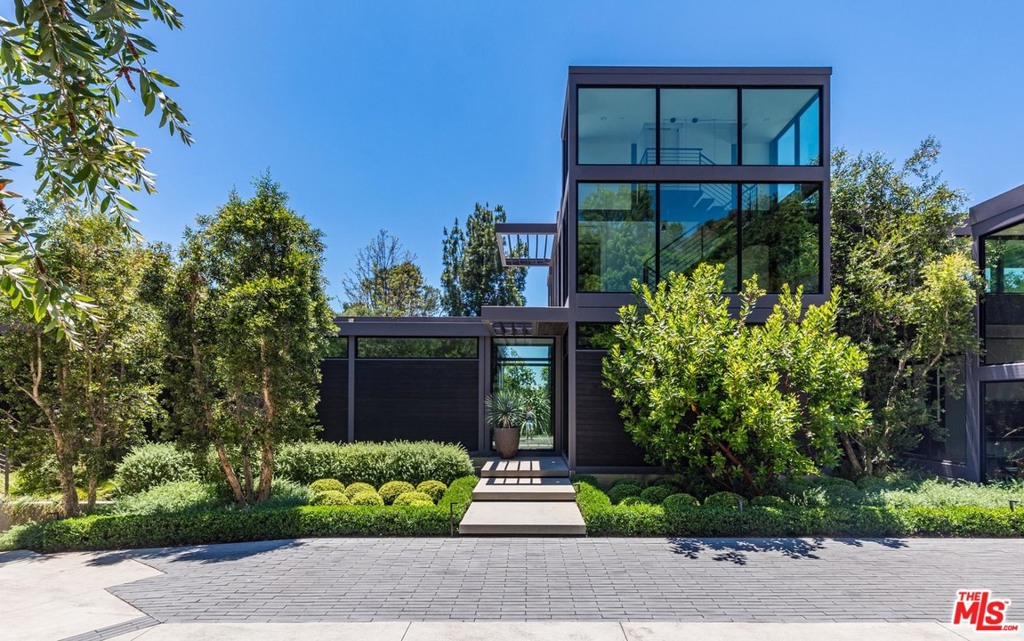 Published on the cover of Dwell Magazine for its achievement in architecture and design. This gated and secluded sanctuary was completed in 2017. Living Homes completely reimagined its RK2 model- a design conceived by the prolific SCI-Arc co-founder Ray Kappe. Nestled in the Beverly Hills Post Office, this stunner stares down a verdant canyon with staggering vista views on approximately three-quarters of an acre. This smart house personifies quintessential California indoor/outdoor living. Infinity edge pool, cold plunge, sauna, and outdoor fireplace are set in complete privacy for those demanding a private retreat. Light, bright, and stylish. This extremely rare offering is shown to prequalified prospects only.