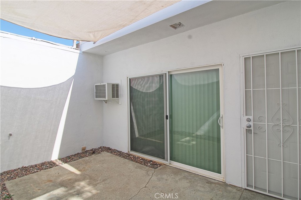 The front courtyard lends just the right amount of extra privacy for this spacious ground level one bedroom, one bath apartment. Large open living area, cozy updated kitchen with new cabinets, counter tops and high top bar overlooking eating area. Updated bathroom with walk-in shower. Large bedroom features walk-in closet with built-in organizers. Private rear patio area with concrete slab.