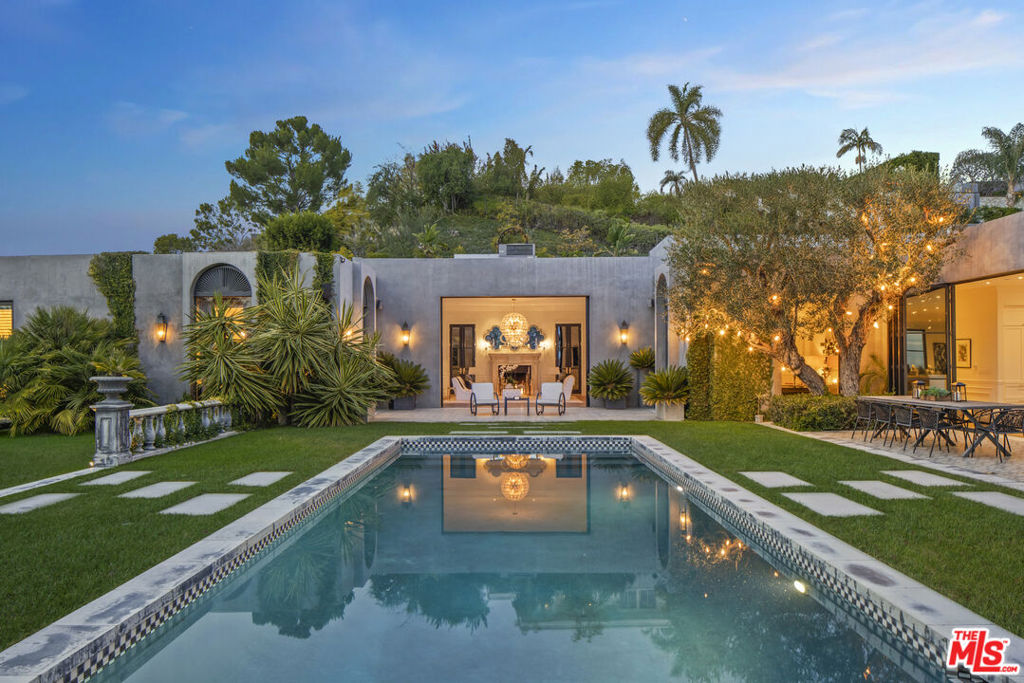 Redefining excellence, Welcome to 1457 Blue Jay Way. Situated on one of the largest flat lots on 'Billionaire's Row' in the Bird Streets, the Blue Jay Regency exhibits a coveted combination of land, location and luxurious living at its finest. The property was originally designed by famed architect Bob Ray Offenhauser, known for his use of perfect symmetry and scale. It is this concept of scale and proportion that anchor the unfolding vistas and coveted Hollywood Regency features in this residence. Award-winning designers, The Garratt Group, have faithfully restored and artfully extended the property with meticulous attention to every detail. The home boasts soaring 14 foot ceilings with custom finishes and the finest, state-of-the-art amenities that showcase the unique architectural style. The home features formal living/family room with Nanawall sliding glass doors to a gorgeous yard with views and unbelievable space. Formal dining with walk out to the yard and complete privacy from every direction! Property amenities include Chef's kitchen with double appliances and Calcutta gold marble counters, reformatted family room off the kitchen for lounging with soaring city views of DTLA, Lower level features a flex space (5th bdrm) with En suite, built-ins and separate entrance perfect for music studio, nanny room or guest room. Lower level west wing features gym/yoga studio space, wet bar with ~500 bottle wine cellar, professionally curated screening room/theater with 14 person capacity, and spa retreat with steam room, dry sauna and hot tub with jets. The home features an undeniably rare rooftop garden with over 80 fruit trees, 2 vegetable gardens, strawberry patch, passionfruit arbor herb garden and all underplanted with Rosemary and sophisticated irrigation system! You have never seen anything like this! Located just minutes from the Sunset Strip, enjoy the close by upscale restaurants and nightlife such as the Boa Steakhouse, Bird Streets Club, Soho House, Pendry & Edition Hotel, Sunset Tower Bar and the city of Beverly Hills just moments away. This ultra rare property comes with all of the greatest modern living features and aesthetics a home of this caliber has to offer! Don't miss this incredible property offering, you have not seen anything like this!
