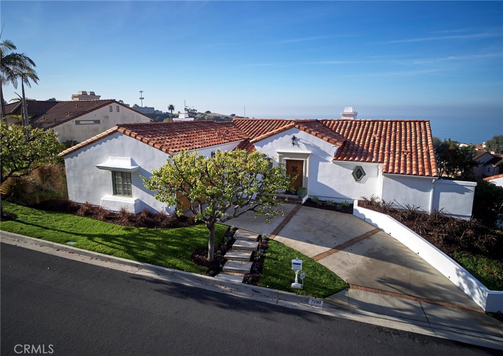 Perched above the endless blue of the Pacific, ocean views envelop this exquisite Old Spanish–style residence, thoughtfully renovated and designed to endure as a timeless showcase of comfort and artistry. From the moment you pass through the rustic custom entry door, you are greeted by a home that blends authentic architectural charm with refined designer finishes.
Less than five minutes from Terranea Resort, Casa Agave reflects the vision of Santiago Designs, who reimagined the property as both a luxurious private retreat and a living work of art. Every detail was selected to create a home that feels as much like an art gallery as it does a sanctuary by the sea. Graceful wood floors, hand-crafted ceramic installations, intricate ironwork, dramatic chandeliers, raised ceilings, and custom art pieces all combine to captivate and inspire.
This four-bedroom, three-and-a-half-bath residence was designed to evoke the serenity of a spa while offering the privacy of a secluded coastal escape. Each bedroom suite opens to its own balcony with sweeping ocean views. The primary suite features a spa-inspired bathroom with soaking tub, while the home itself is furnished and outfitted with carefully curated pieces—from bedding and furniture to kitchenware and appliances—that speak to quality and taste.
Casa Agave is more than a home; it is an experience. A place where Spanish architecture, coastal vistas, and curated design converge to create a truly one-of-a-kind lifestyle on California’s most scenic coastline.