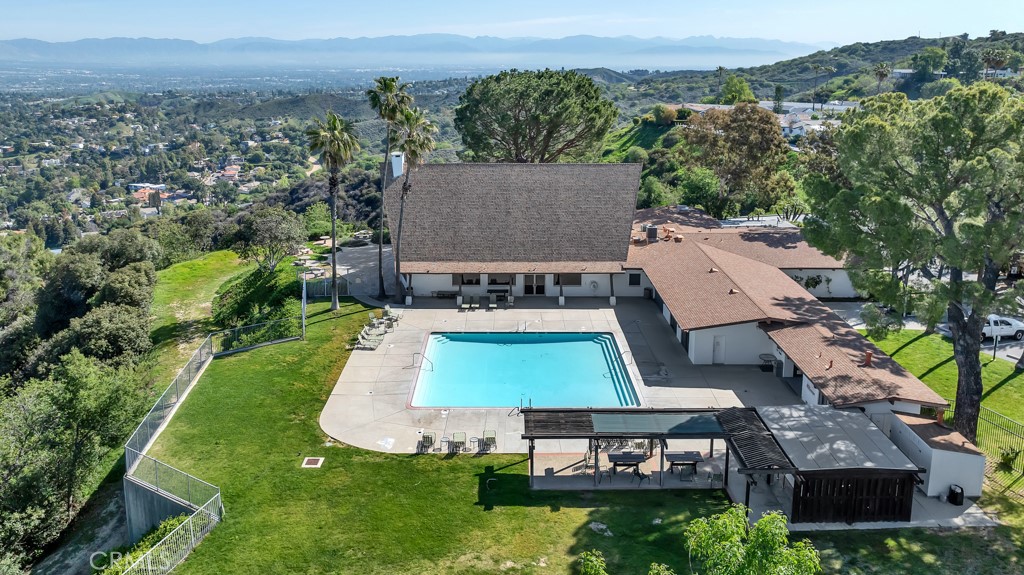 Spectacular new value in the serene heights of Topanga! This exquisitely remodeled single-story residence, crafted and curated by a European artisan, offers a rare blend of tranquility, artistry, and modern luxury. Surrounded by lush greenery and breathtaking canyon views, this private retreat has been enhanced with over $200,000 in refined upgrades.  The lowest priced home per square foot in this gated community, it is the opportunity you have been looking for!
A Japanese-style entry stairway welcomes you into a sun-filled living room where natural light and warmth set the tone. The chef’s kitchen is a true centerpiece, featuring a solid walnut prep island with sink, custom white lacquer cabinetry with pull-out pantry, farmhouse sink, and stainless steel appliances — all illuminated by a Velux vented skylight that flows seamlessly into the adjacent living and dining rooms.
The sophisticated 1,736 sq. ft. floor plan includes a stylish dining room, a spacious family room, and new heart-pine floors throughout. Secondary bedrooms are in their own private wing and share a beautifully renovated bath, complete with rainfall shower, Spanish tile, and Calacatta quartz vanity.
The primary suite is a serene escape, distinguished by custom mahogany millwork and a spa-like bath with stone shower base, rainfall features, and handcrafted walnut cabinetry. A convenient interior laundry room with abundant storage opens to a sun-drenched patio framed by fruit trees — grapefruit, peach, olive, Japanese magnolia — and vegetable planters with Bluetooth irrigation. Soft evening lighting and tranquil garden spaces create an atmosphere of European charm and Topanga magic.  Additional features include recessed lighting, a new metal toolshed, and gated community amenities: panoramic pool, spa, gym, library, playground, hiking trails, and spectacular viewing decks. Ownership is fee simple with a community rider shared among 220 homes: you own the land on which this home is located. 
Perfectly situated minutes from Calabasas, Malibu, Woodland Hills, and Pepperdine, this unique home offers an ideal balance of peace, artistry, and convenience. Small assumable loan with low interest rate available, please ask us more information and detail. Also for lease at $4,600/mo. — a true must-see.  Make your appointment today and be HOME for the Holidays!