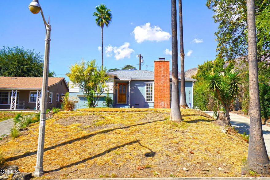 First time on the market in 59 years, this 1948 Traditional home presents a rare investment opportunity with endless potential to reimagine and add value. The property offers three spacious bedrooms, two bathrooms, and a 21' x 15' office/bonus room. The expansive living room features a classic masonry fireplace and large windows that flood the space with natural light, while the adjacent formal dining room and kitchen with breakfast nook create a functional layout ready for modernization. The backyard offers excellent usability with brick pavers on one level and a grassy area on the second level, complemented by a detached two-car garage at the rear of the property--perfect for additional development possibilities such as an ADU (buyer to verify). Recent upgrades include new vinyl plank flooring and new insulation, leaving cosmetic renovations as the next step to maximize return. This is an exceptional opportunity for investors, developers, or owner users to capitalize on a home with strong fundamentals, a generous lot, and versatile spaces. Assessor's records indicate 1,554 square feet, while measured interior square footage is 1,910 (buyer to verify permits).