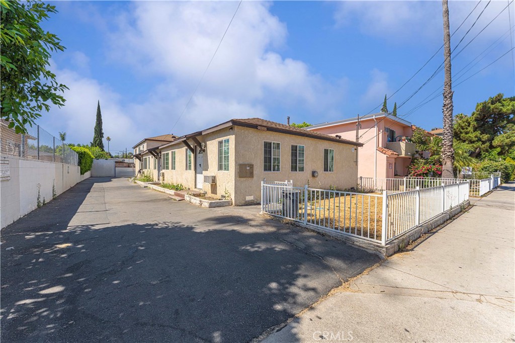 This well-maintained four-unit multi-family building is situated in the heart of the San Fernando Valley. Built in 1948, this residential income property spans approximately 2,756 sq. ft. on a 7,527 sq. ft. lot. It comprises three 2-bedroom, 1-bath units and one 3-bedroom, 1-bath unit, offering significant rental upside potential. Recent Upgrades to the building include newer paint, roof, windows, and driveway. Each unit is individually metered for gas and electricity and features its own water heater. There is on-site garage parking available for each unit, totaling eight spaces.
Located in East Van Nuys, the property benefits from its proximity to essential amenities and transportation options. It is within walking distance to grocery stores, restaurants, and public transit lines, enhancing its appeal to its tenants. Sherman Way, a major east-west thoroughfare, runs through Van Nuys and offers convenient access to various parts of the city. Ralphs Supermarket and Norms Restaurant are just half a block away, offering convenient shopping and dining options. This property presents a compelling opportunity for investors seeking a well-located, income-generating asset with potential for rental growth in a vibrant and accessible neighborhood.
