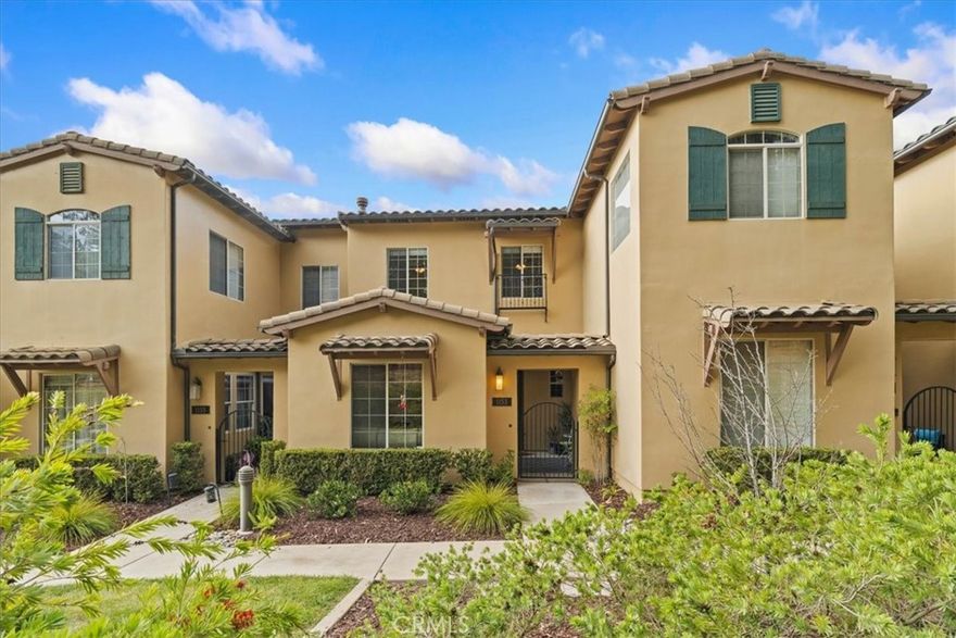 Step into refined coastal living at this elegant townhouse in the beautiful Trilogy at Monarch Dunes community. Beyond a gated courtyard is a 1,639 square foot home with 3 bedrooms, 2 full bathrooms, and a downstairs powder room. The open-concept main level connects the kitchen, dining room, and living room areas beneath recessed lighting anchored by a stone-surround fireplace adding warmth and character. A view of the tranquil monarch butterfly habitat is seen from the living room window. The kitchen features granite countertops with a stylish backsplash, a breakfast bar accented by pendant lighting, a gas stove, stainless steel appliances, and generous storage with shaker cabinets and a walk-in pantry. A dedicated laundry room with ample cabinetry leads to a two-car garage with built-in storage.

Upstairs, the spacious primary suite includes a walk-in closet and opens through a glass sliding door to a private balcony. The ensuite bath offers dual sinks and a walk-in shower. Two additional bedrooms and a full bath provide space for family, guests, or a home office. The living space is enhanced by a skylight and abundant windows to provide plenty of natural light.

Within Trilogy, residents enjoy a wealth of resort-style amenities including an 18-hole golf course, 12-hole challenge course, Adelina’s Bistro, The Butterfly Grill, Sandalwood spa, a heated lap pool, art studio, and courts for tennis, pickleball, and bocce ball along with many other amenities for an exceptional blend of leisure and luxury living.